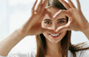 woman making a heart shape with her hands