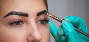 henna being added to eyebrows