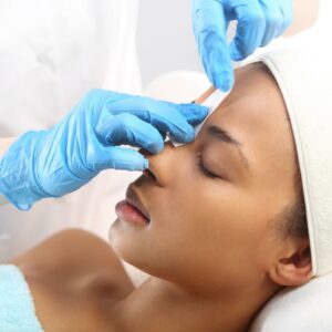 Woman having her eyebrows waxed