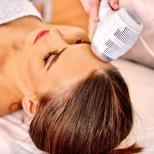 Woman getting an electric facial