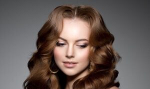 Woman with brown long curly hair