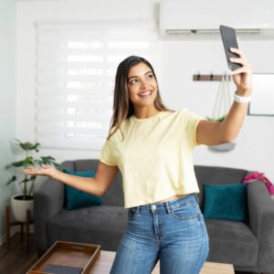 Woman holding her phone and doing a video