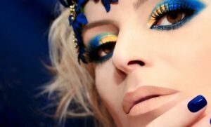 Woman with blue flower makeup