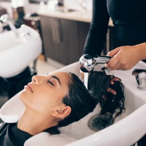 Woman having her hair washed at a hair salon