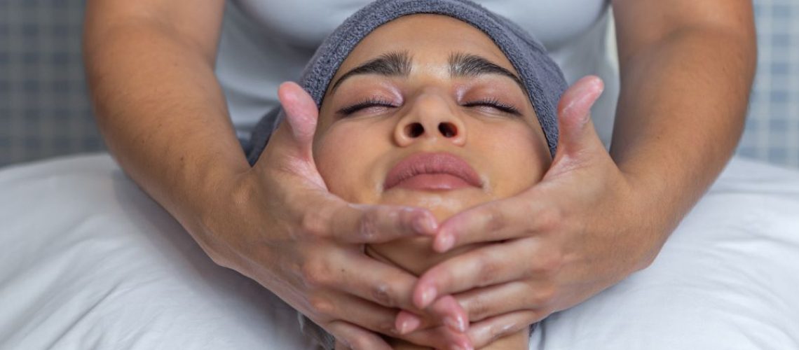 Woman receiving a facial