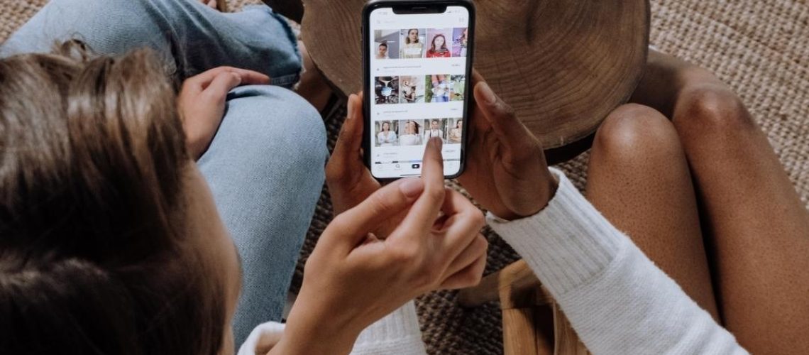 Two people looking at a phone