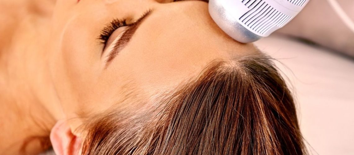 Woman getting an electric facial