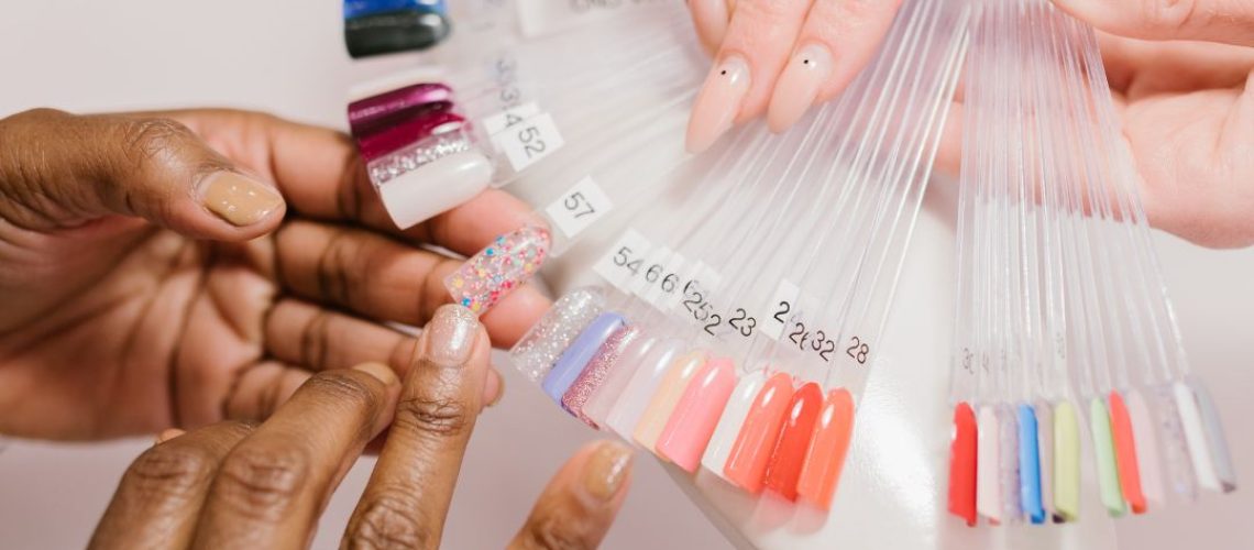A woman testing nail colors