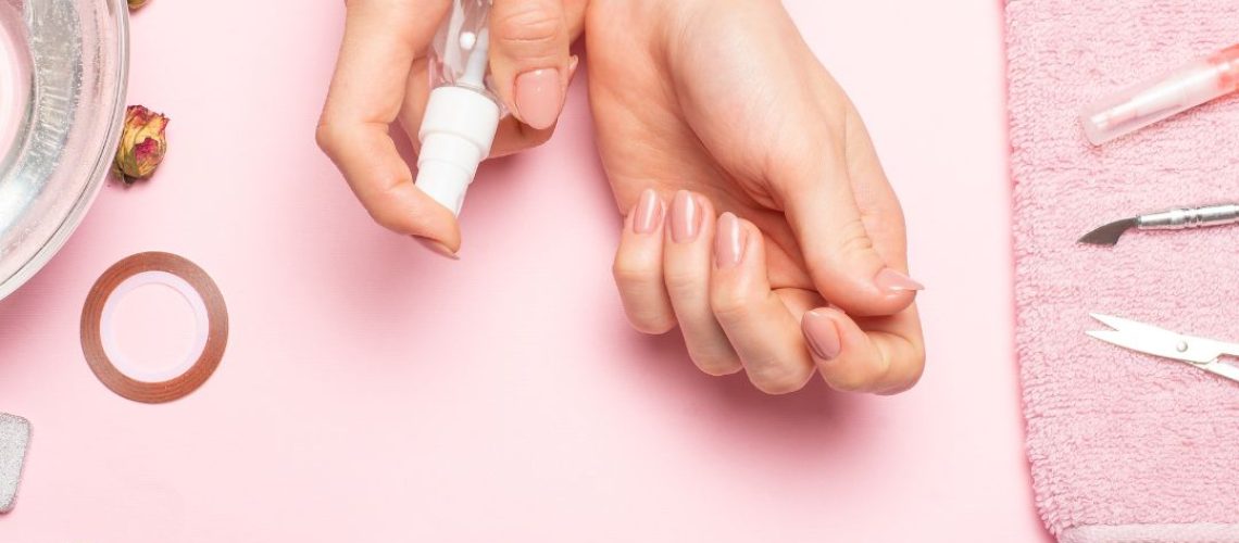 Hands with drying nail polish