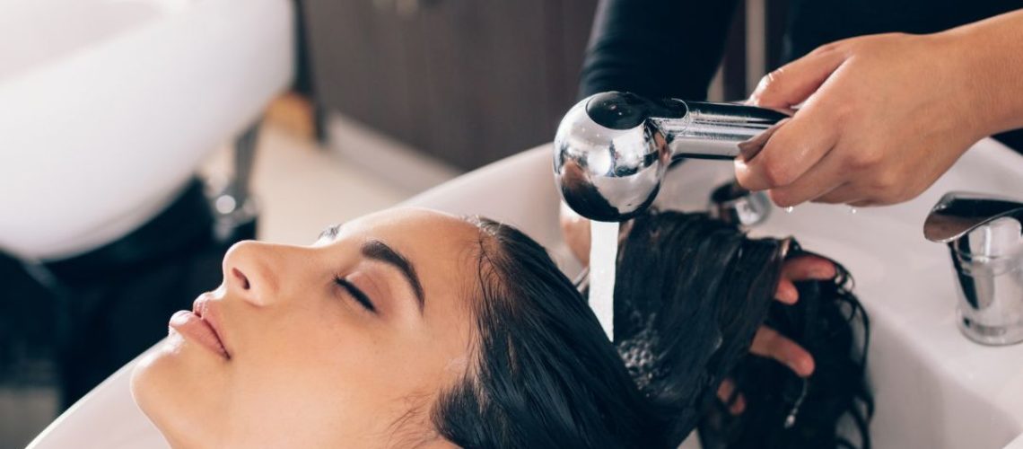 Woman having her hair washed at a hair salon