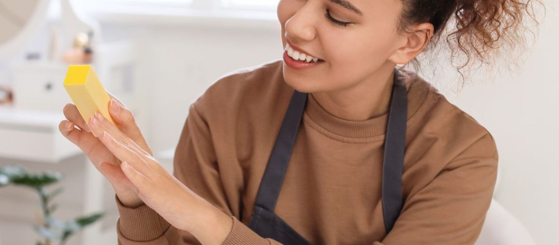 Nail tech holding nail product