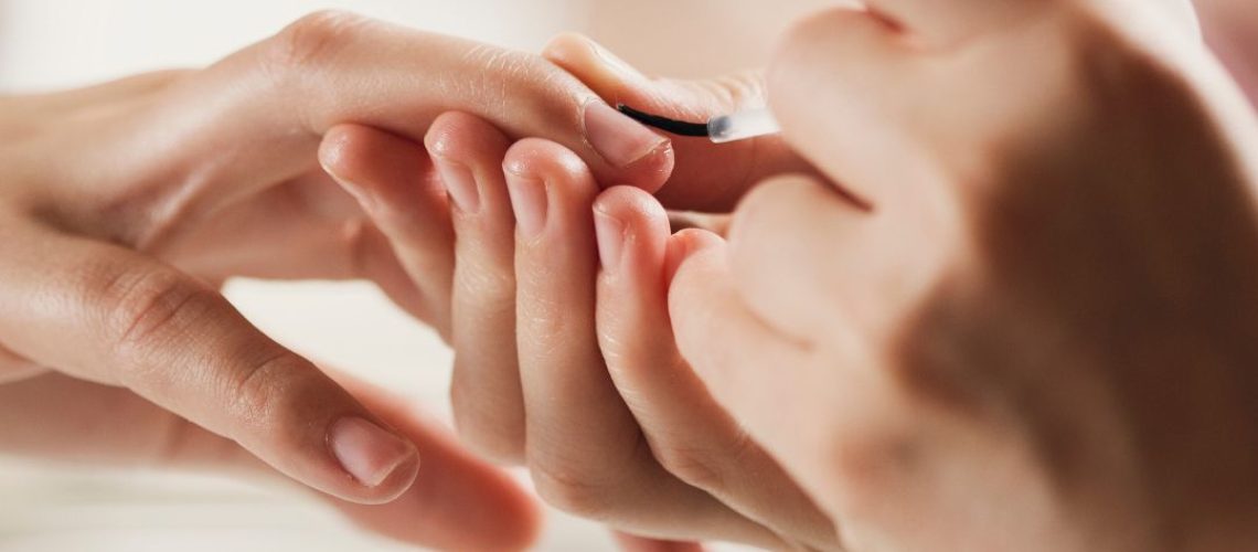 Someone doing someone else's nails