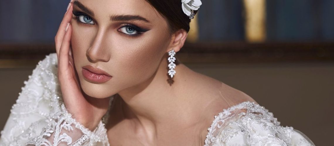 Woman in a white dress with makeup on